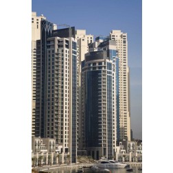 UAE, Dubai Marina towers with boats at anchor