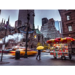 Tourist with umbrella on streets of Lower Manhattan, New York